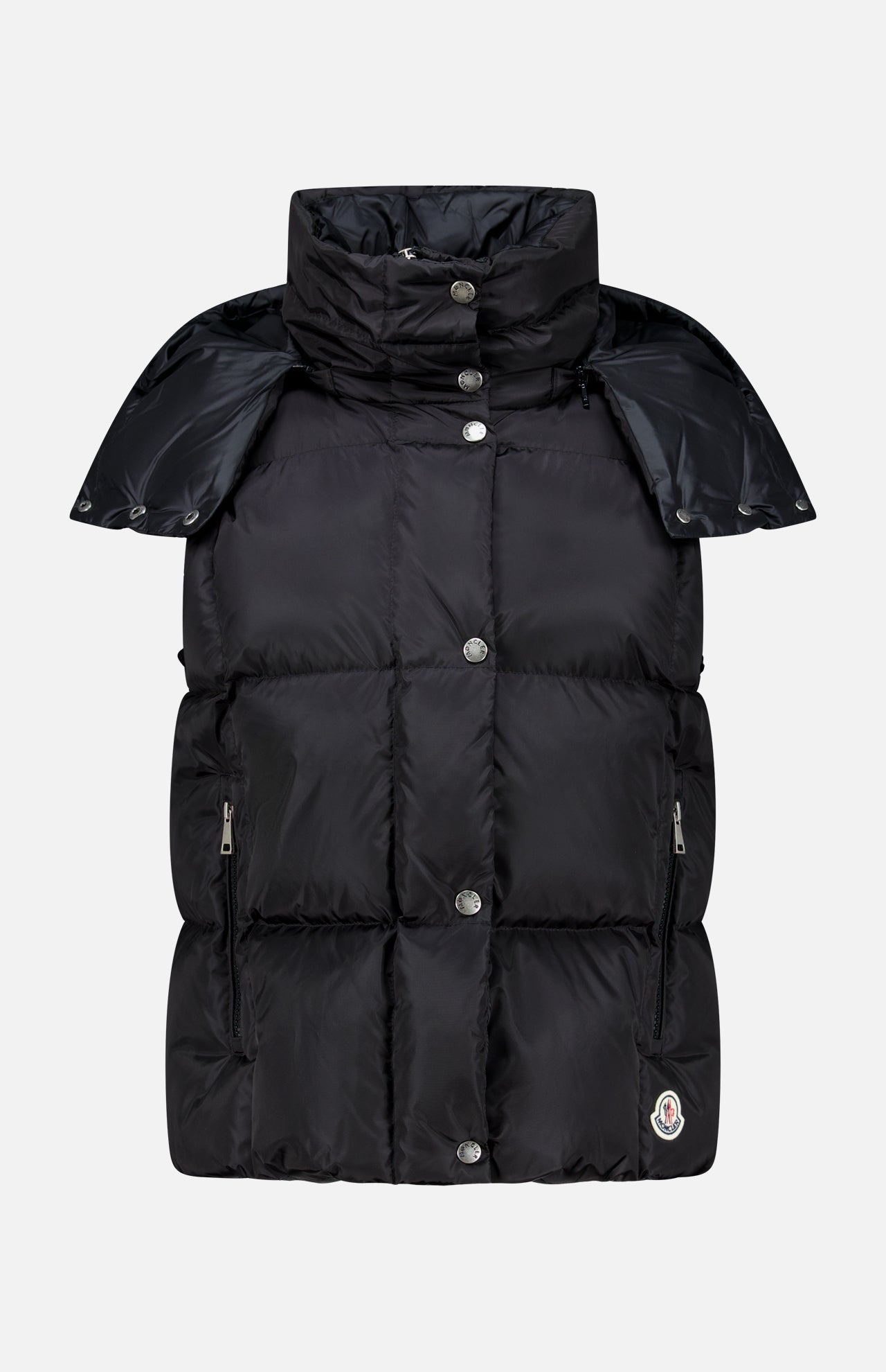 The MONCLER Macareux Down Puffer Vest, shown in black against a white background, features a high collar, snap buttons, zippered side pockets, and a subtle logo patch near the hem. This stylish vest offers water-repellent down outerwear ideal for chilly days.