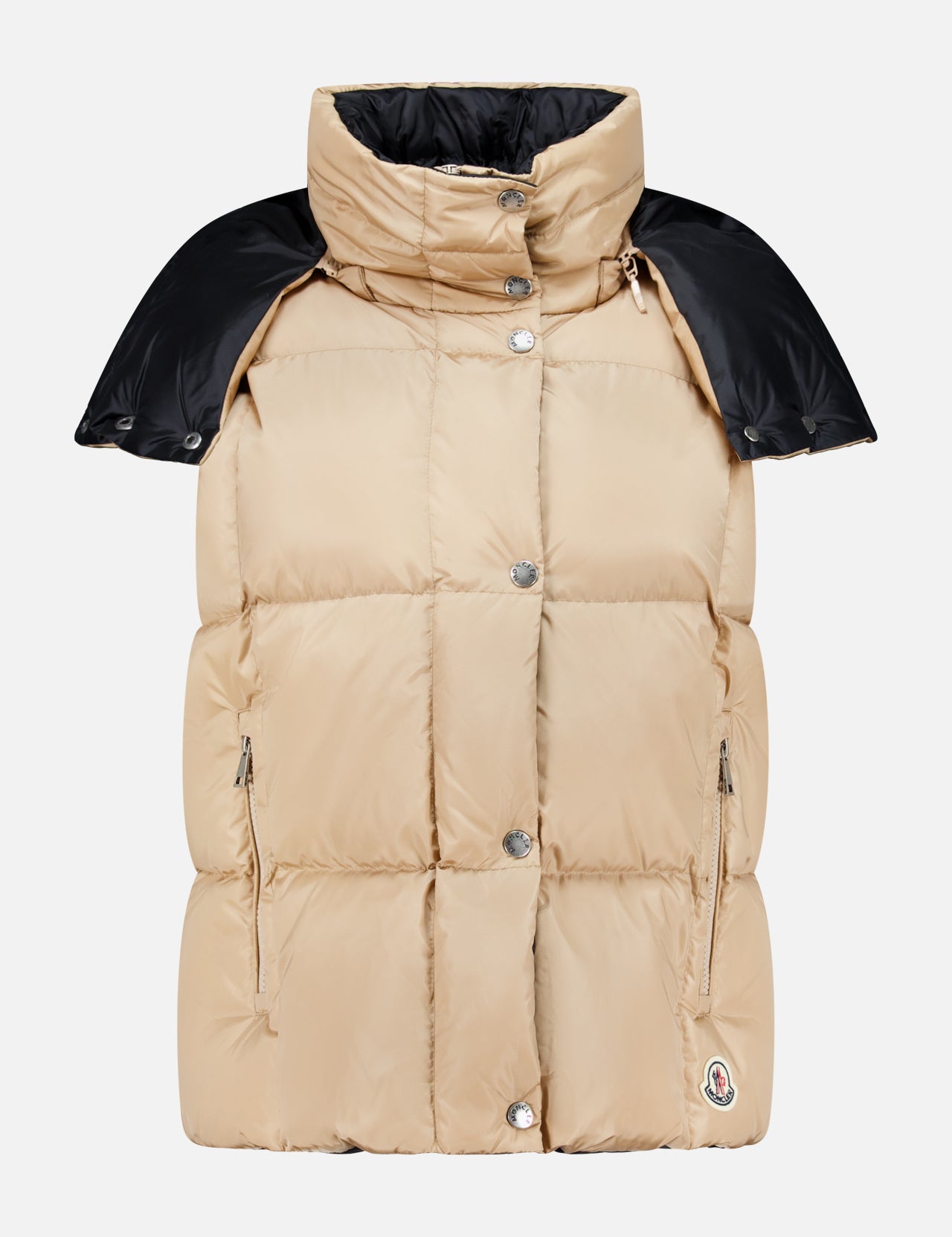 The Macareux Down Puffer Vest by MONCLER features a beige design with silver buttons, zipper pockets, a high collar, and black shoulder detailing, all set against a plain white background. Engineered for lightweight warmth and water-repellency, this vest seamlessly blends style with functionality.