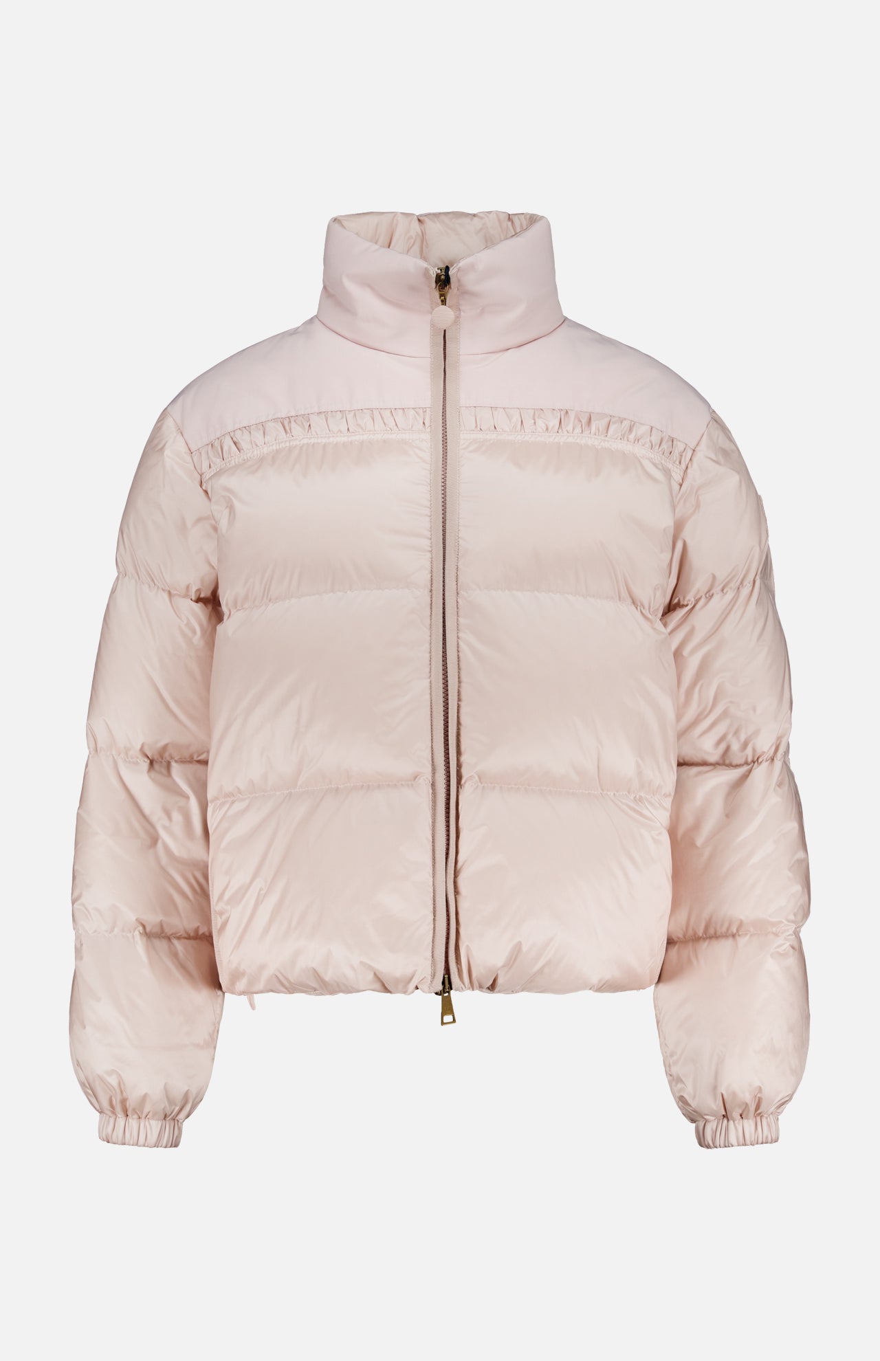 The Meditation Puffer Jacket by MONCLER is a light pink, down-filled, quilted jacket with a front zipper, high collar, elastic cuffs, and a slightly cropped fit, shown on a plain white background.