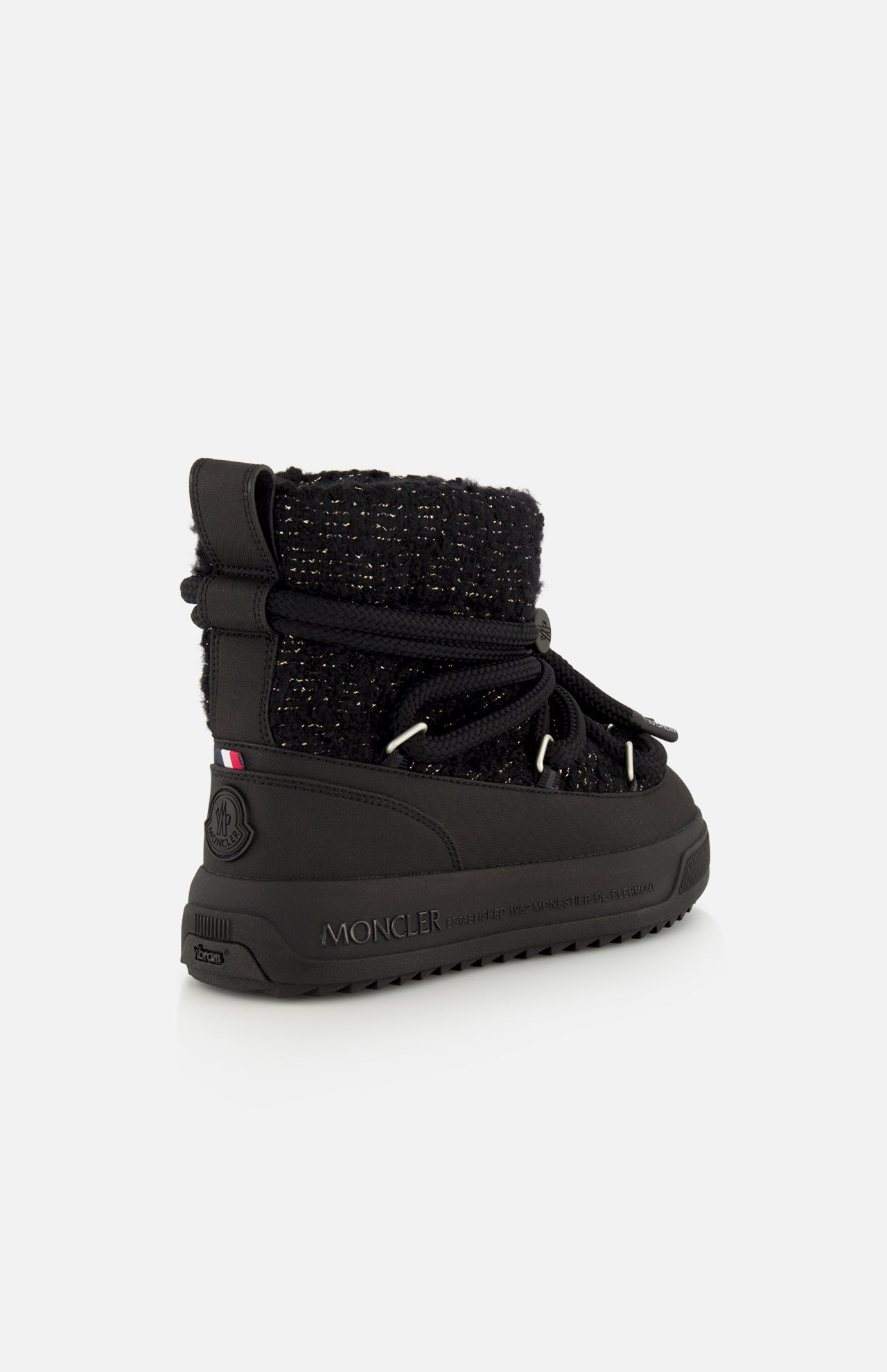 Black mid-calf Moncler Altive Mid Snow Boots with a textured fabric upper, rope lacing system, and a thick Vibram MEGAGRIP lugged rubber sole.