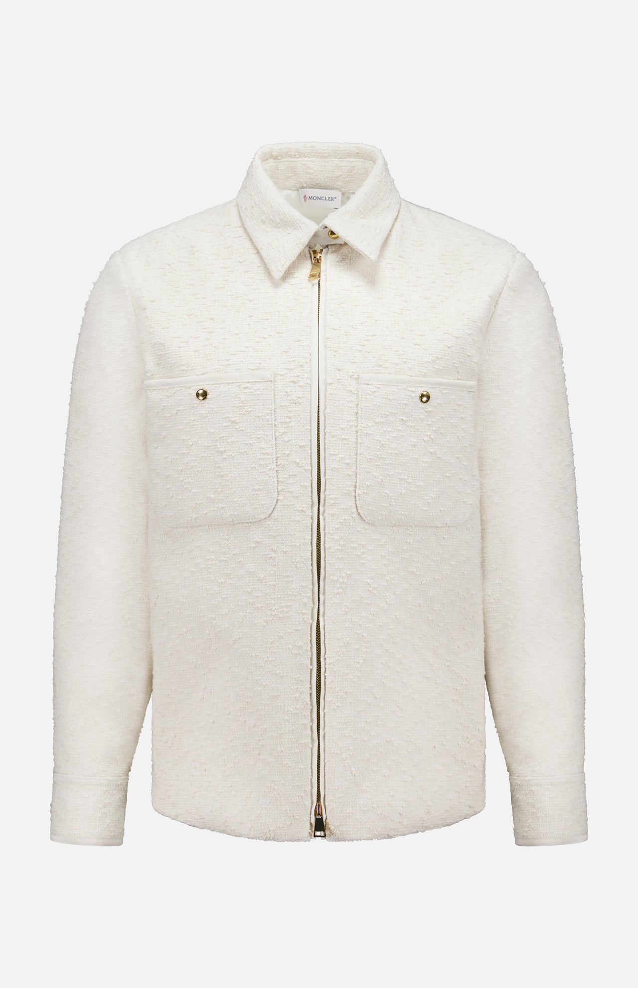 The MONCLER Bouclé Fabric Shacket Shirt in cream features long sleeves, textured cotton-blend bouclé, a classic collar, front zipper closure, and two button-flap chest pockets, shown against a plain white background.