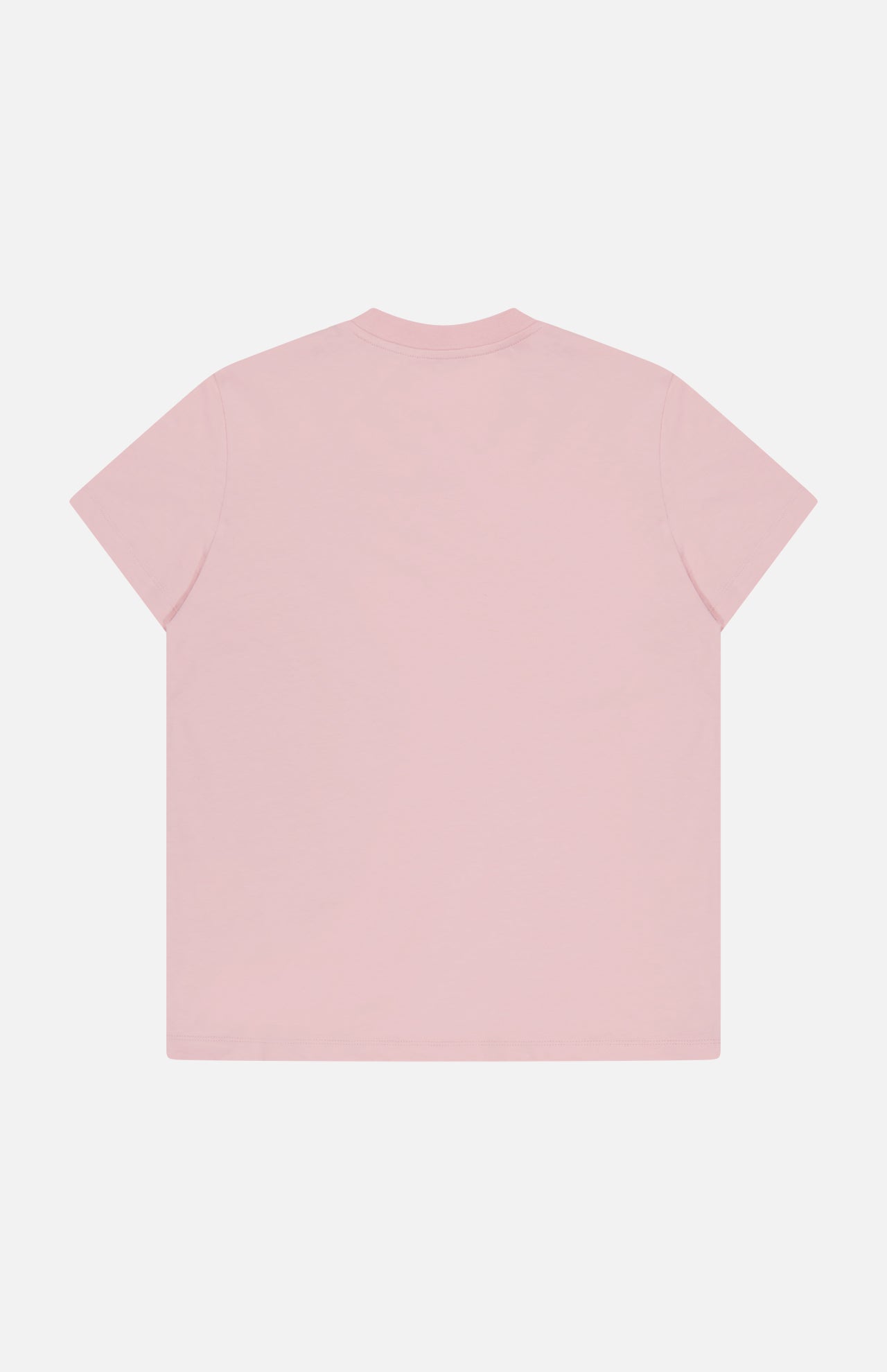 A Short Sleeve T-Shirt by MONCLER in light pink is displayed flat, showing its back on a white background. The design is simple and classic, with no visible logos or patterns.