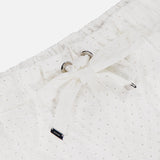 Close-up of the MONCLER Drawstring Eyelet Shorts’ white waistband with adjustable drawstring, silver grommets, and a branded metal tag detail at the end.