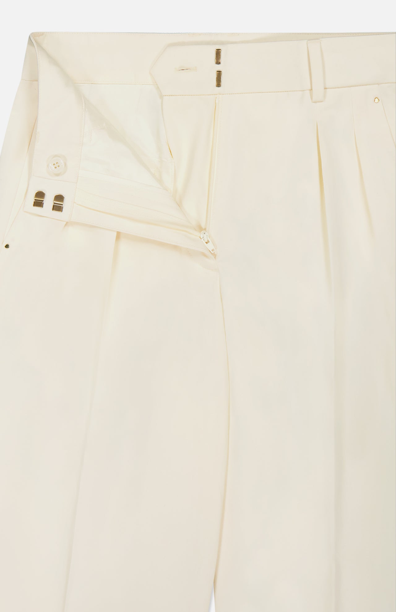 MONCLER Wide Leg Trousers in cream feature pleats, a partially open waistband with zipper, inner button, and hook-and-bar closure—a refined update of the classic trouser.