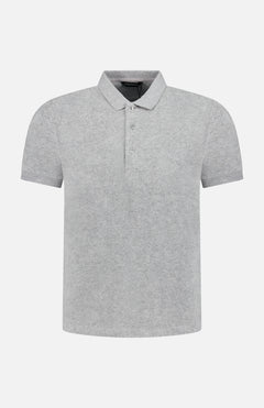 The MONFRERE Pierce Polo Shirt is a men’s fashion polo in light gray, featuring a collar and three buttons, made from soft cotton-blend terry, shown on a white background.