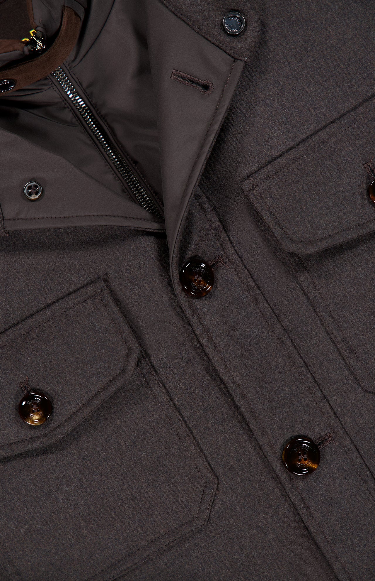 Close-up of the Dasson Removable bib Jacket by MOORER, made from brown virgin wool with large buttons, flap pockets, and a visible zipper on the inner lining. The thick fabric is ideal for cold weather.
