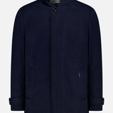 The Reis Removable Bib Jacket by MOORER features a navy blue design with high collar, button closure, side pockets, buttoned cuffs, and a detachable puffer bib, shown on a plain white background.
