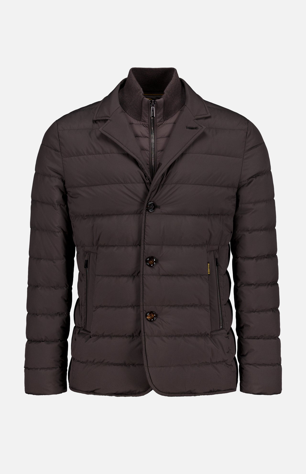 The Sinardi Removable Bib Jacket by MOORER is a dark brown blazer-style jacket with two front pockets, two buttons, a visible inner zipper layer, and a detachable puffer bib for added warmth and style.