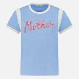 The Boxy Goodie Inset T-shirt by MOTHER is a light blue, boxy-fit short-sleeve tee with white shoulder and sleeve accents, featuring "Mother" in red cursive across the chest.