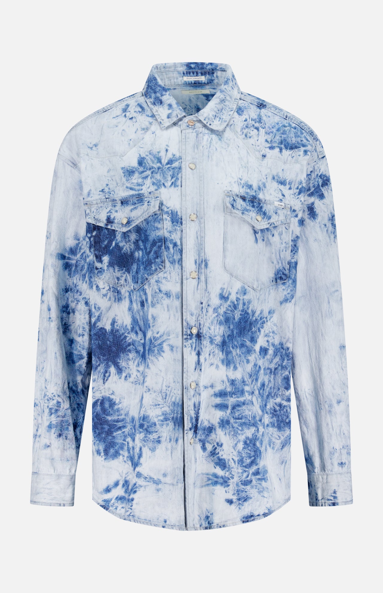 The Exes And Ohs Overshirt by MOTHER is a Western-inspired, long-sleeve button-up with two chest pockets and a light blue and white tie-dye floral print on crisp white.