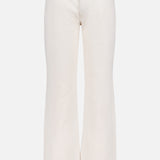The Scooter Skimp Flare Leg Pant by MOTHER is a high-rise, white jean featuring wide flare legs, front and back pockets, belt loops, and a button closure in rigid cotton denim, shown against a plain white background.