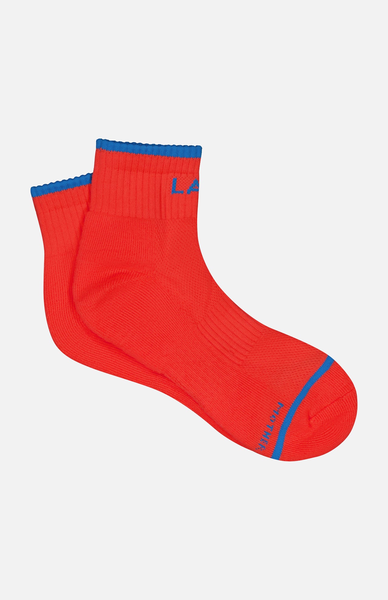 The MOTHER Baby Steps Ankle Socks are bright red with blue trim at the cuff and toe, visible ribbed texture, and blue lettering near the toe and cuff—perfect for making a bold statement.