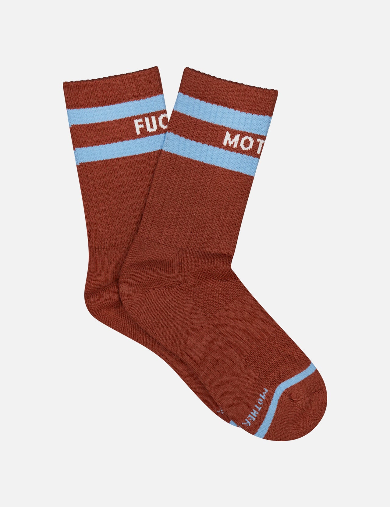 A pair of MOTHER Baby Steps Stripe Socks in brown with light blue stripes near the top. These unisex socks feature white text that partially reads “FUC” on one and “MOT” on the other.
