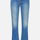 The Lilrunaway Jeans in On A Roll by MOTHER are blue denim petite jeans with a slight flare at the bottom, faded detailing on the thighs, front button and zipper closure, and both front and back pockets. These mid-rise jeans are displayed against a white background.