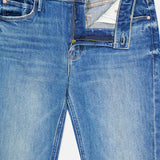 A pair of MOTHER Lilrunaway Jeans in On A Roll, featuring a petite fit, mid rise silhouette, partially opened zipper and button fly, and front pockets. The faded blue wash and worn-in finish offer effortless everyday style.