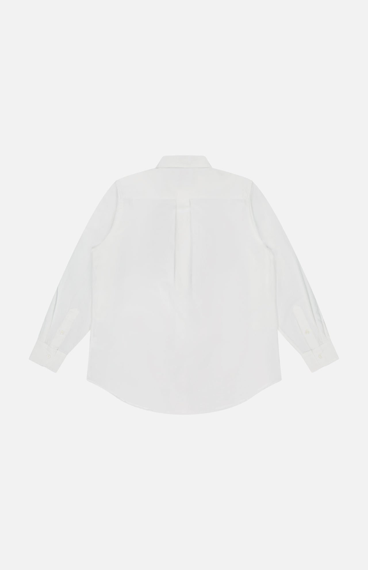 The Bestie Button-front Shirt by MOTHER is shown from the back in plain white 100% cotton, featuring a center pleat, buttoned cuffs, classic collar, and curved hem.