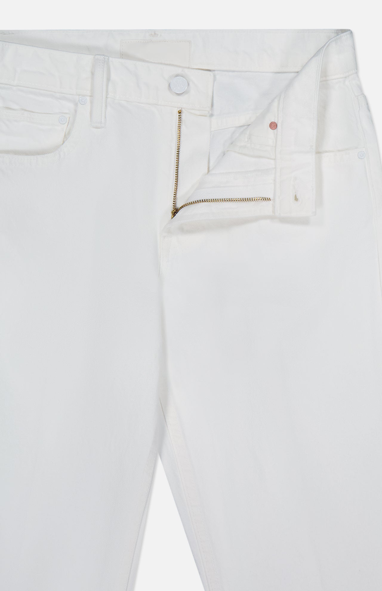 The Bookie Skimp Pant in Picket Fence by MOTHER is a pair of white mid-rise denim jeans with an open waistband, zipper, and button fly, shown laid flat against a white background.