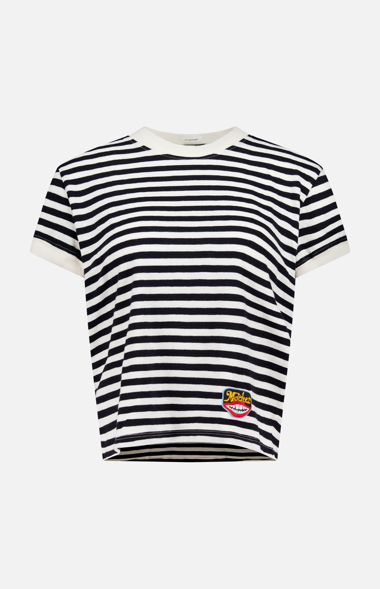 Introducing the Boxy Goodie Goodie T-shirt by MOTHER—a short-sleeved crew neck tee with bold black and white stripes, designed for a relaxed boxy fit. Crafted from 100% cotton, it features a crisp white collar and sleeve trim along with a small, colorful patch sewn near the bottom left hem.