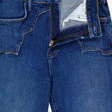 The Buckle Bunny Hustler Jean in Cosmic Cowgirl by MOTHER features dark blue stretch denim with a brass button and a partially open zipper fly that reveals the inner pocket lining. These high-rise flare jeans showcase visible stitching and uniquely curved front pockets, adding a subtle western-inspired detail.
