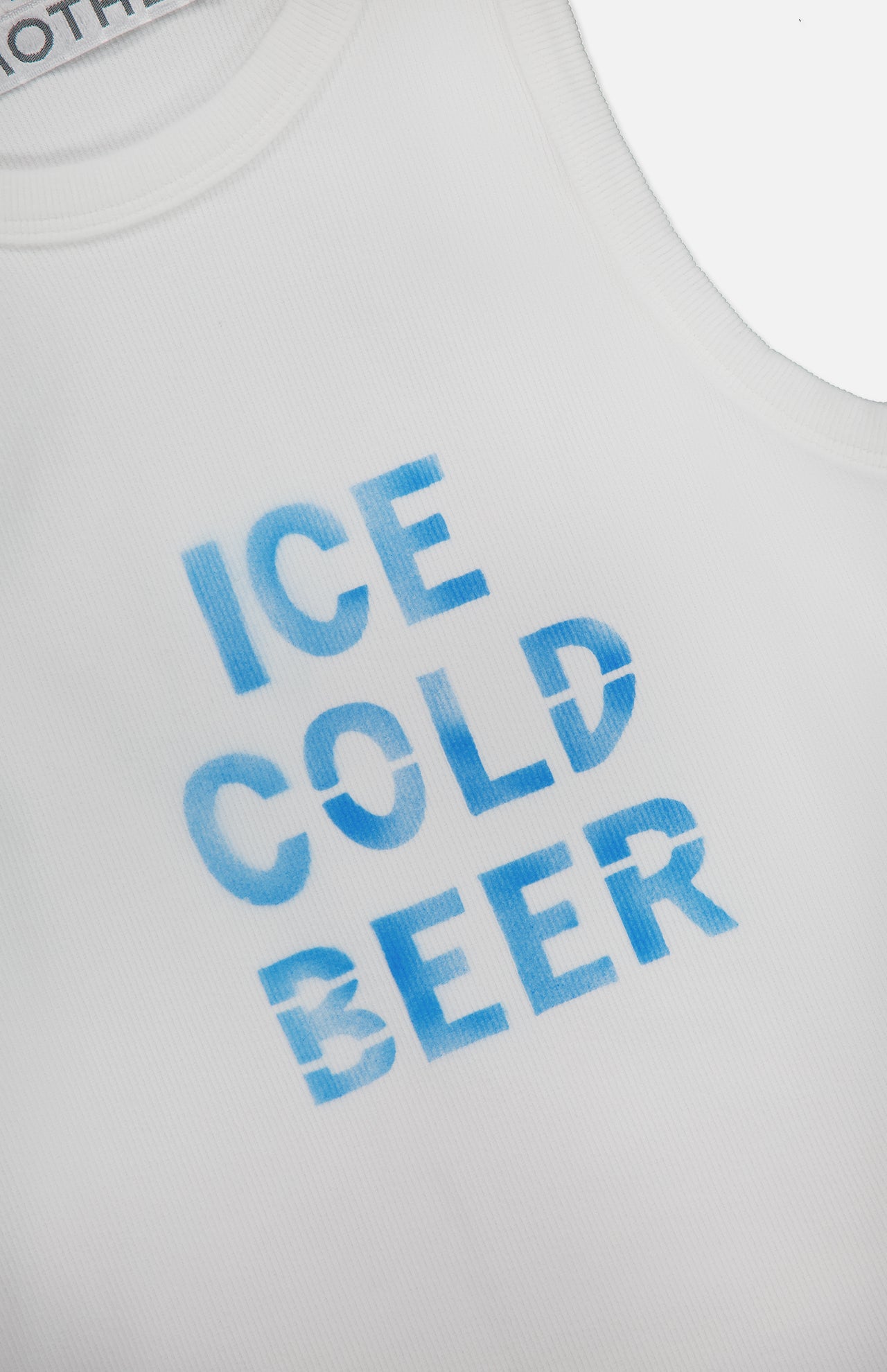 The Chin Ups Chop Tank Top by MOTHER is a white, ribbed cotton-blend cropped tank with “ICE COLD BEER” in bold blue across the front—ideal for laid-back summer style.