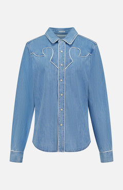 The Country Exe’s Shirt by MOTHER is an oversized, light blue denim shirt featuring long sleeves, a pointed collar, snap button closure, and white stitched decorative details along the chest and seams. Displayed on a plain white background, this classic western button-up brings timeless charm to any wardrobe.