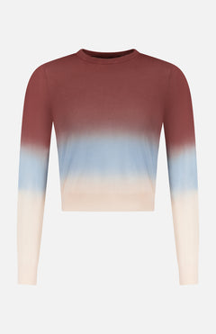 The MOTHER Crew Neck Ombre Jumper Sweatshirt features long sleeves and a gradient design, fading from dark reddish-brown at the top to light blue in the middle and cream on the bottom and sleeves.