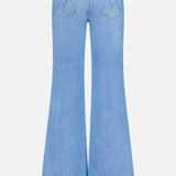 The Doozy Jean in Room Service by MOTHER is a light blue, high-waisted vintage-inspired denim with two back pockets featuring stitched details and wide bell-bottom legs, shown from the back.
