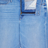The Doozy Jean in Room Service by MOTHER features light blue denim with a subtle vintage-inspired fade. Shown with the top button undone and zipper partially open, revealing the inside waistband and pocket lining.