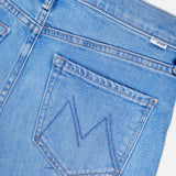 Close-up of the back of MOTHER's The Doozy Jean in Room Service, showcasing a stitched M on the back pocket and a visible waistband belt loop.