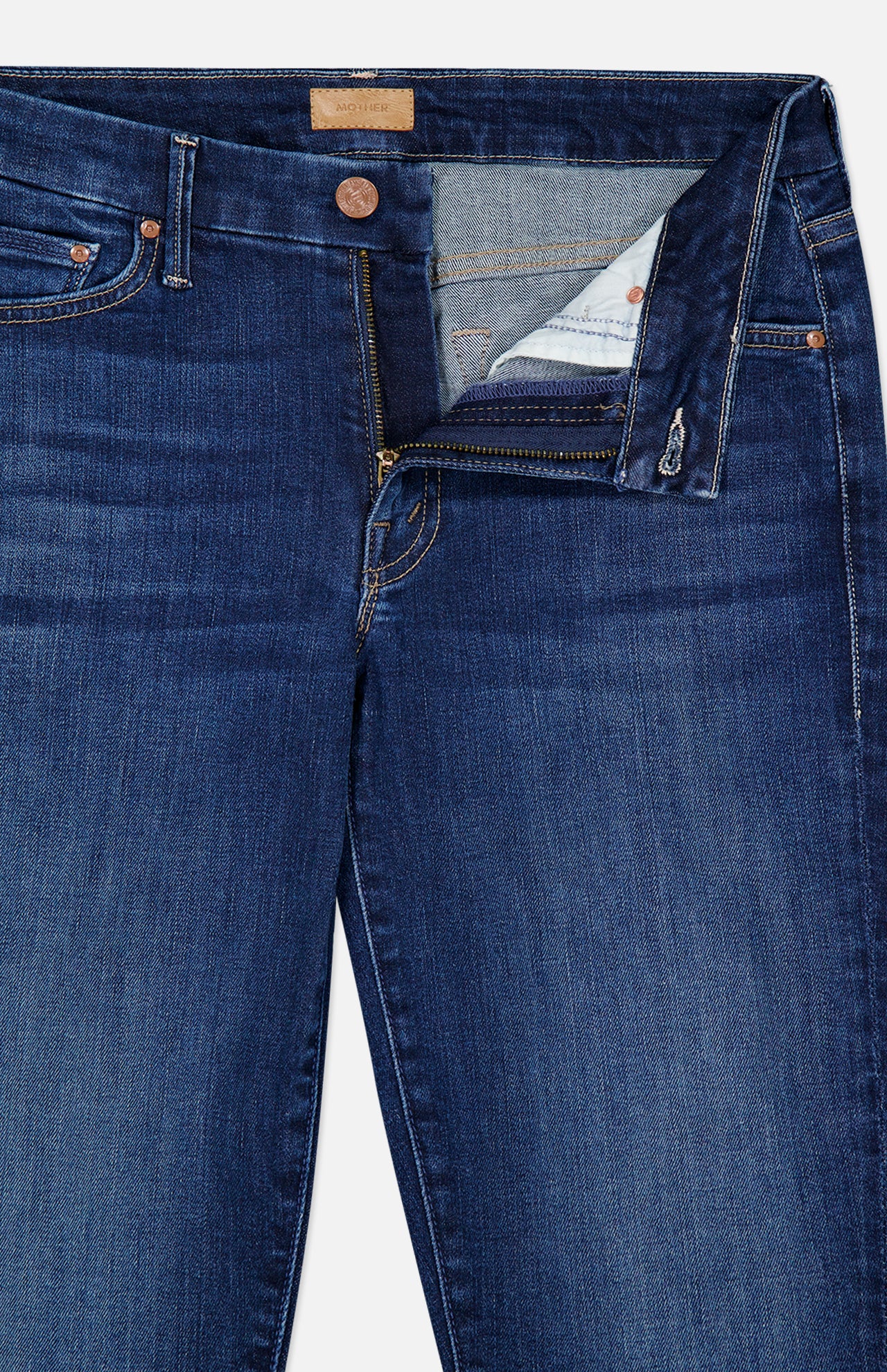Dark blue stretch denim skinny jeans, the Mother The Down Low Looker Hover Jeans in Backstage, with a partially unzipped fly and a button closure at the waist.