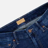Close-up of the waistband, button fly, and leather label on dark blue stretch denim The Down Low Looker Hover Jeans in Backstage skinny jeans.