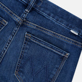 Close-up of the back of dark blue stretch Mother The Down Low Looker Hover Jeans in Backstage, featuring a back pocket with a stitched M logo and a small logo tag at the waistband.