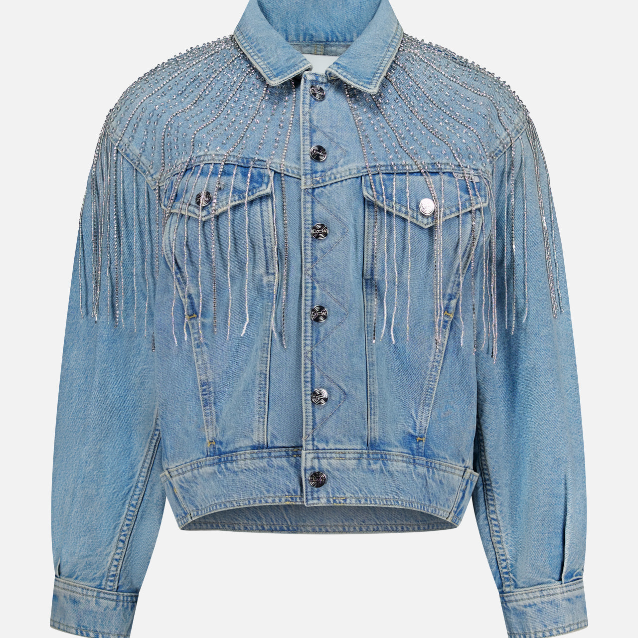Add a touch of sparkle to any outfit with the MOTHER Rhinestone Fringe Fly Away Jacket. This standout party piece features light blue denim, silver rhinestone fringe on the front, shoulders, and back yoke, a button-up front, chest pockets, and a slightly cropped fit.