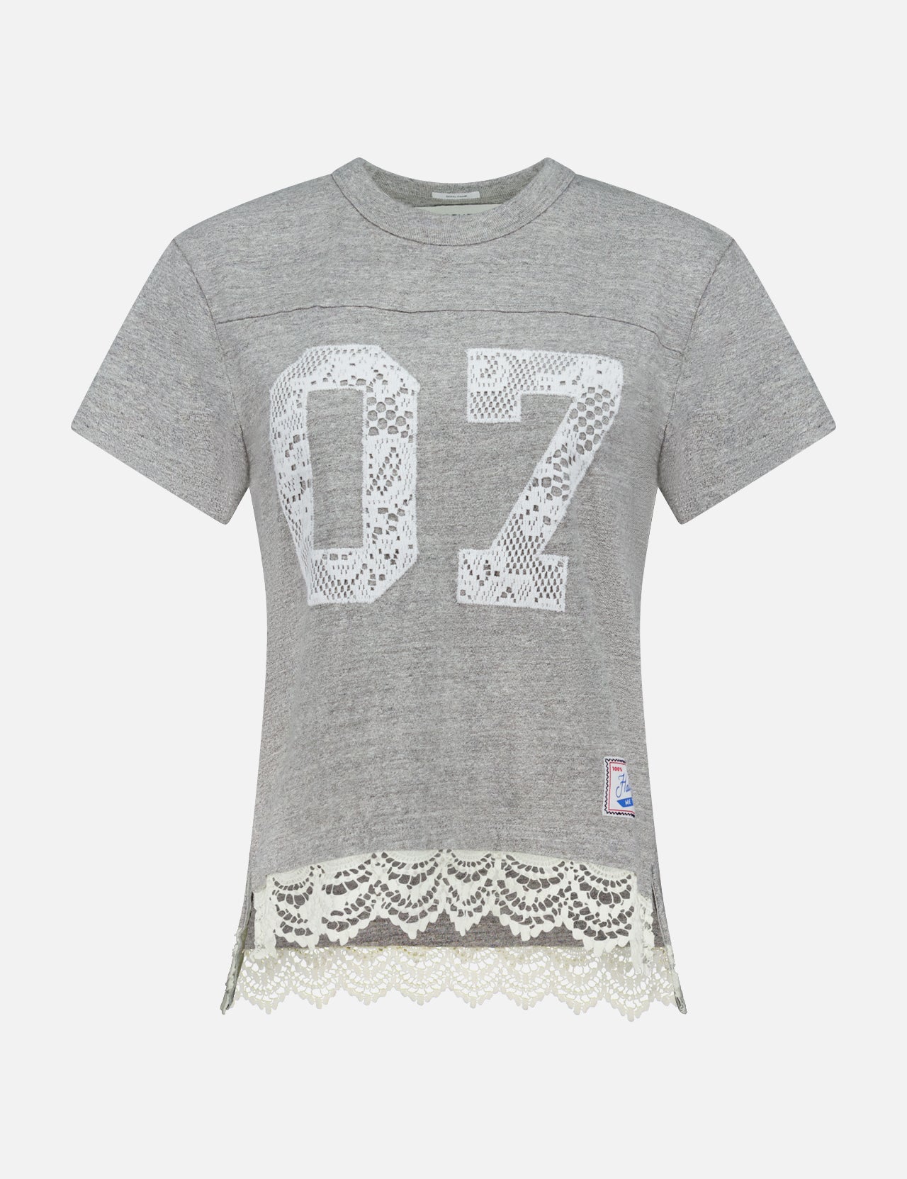 The Footballer Lace T-shirt by MOTHER is a sporty, boxy-fit gray short-sleeve tee with a white lace “07” on the front, lace hem trim, and a small patch—perfect for channeling football jersey vibes.