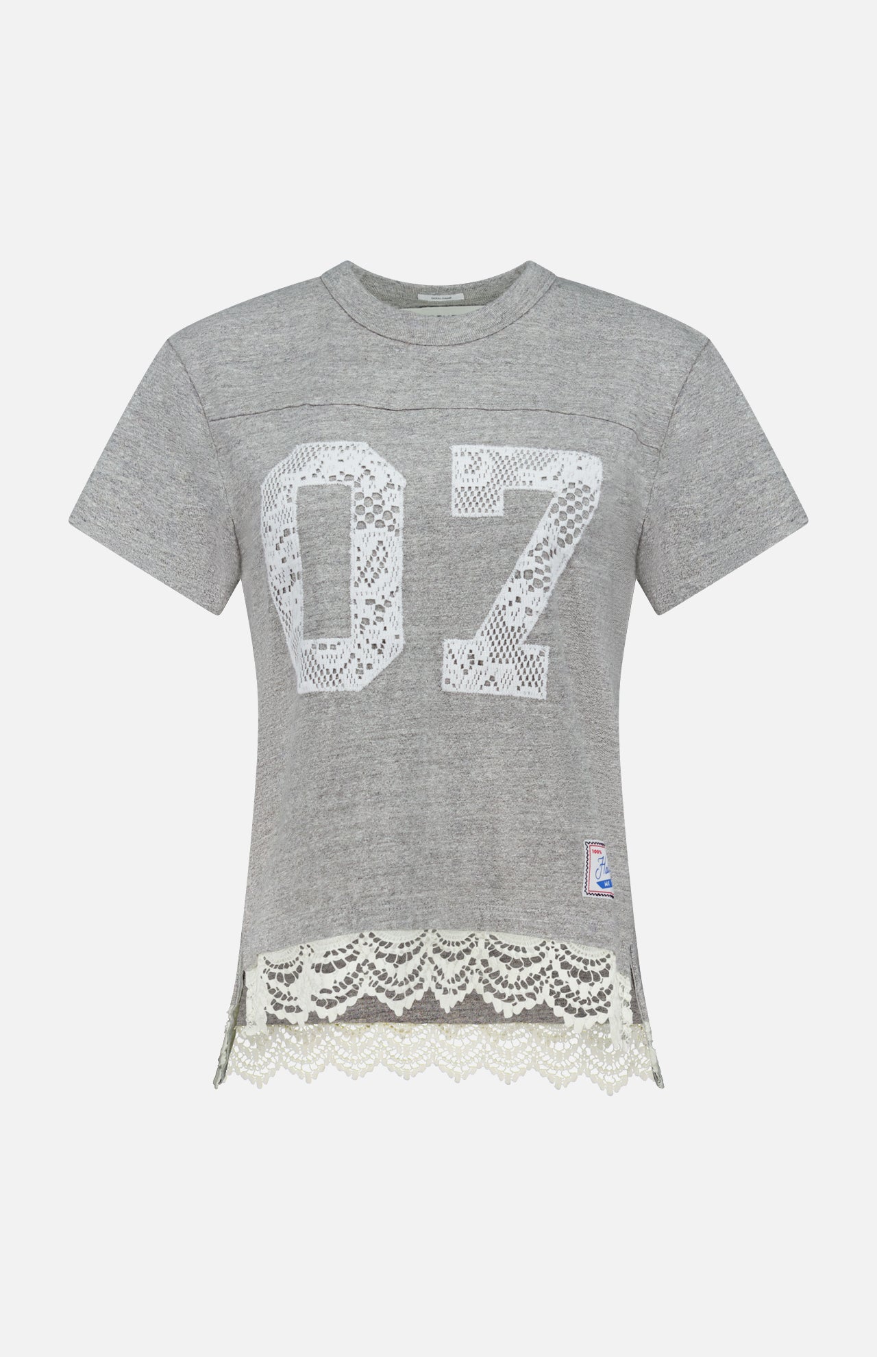 The Footballer Lace T-shirt by MOTHER is a sporty, boxy-fit gray short-sleeve tee with a white lace “07” on the front, lace hem trim, and a small patch—perfect for channeling football jersey vibes.