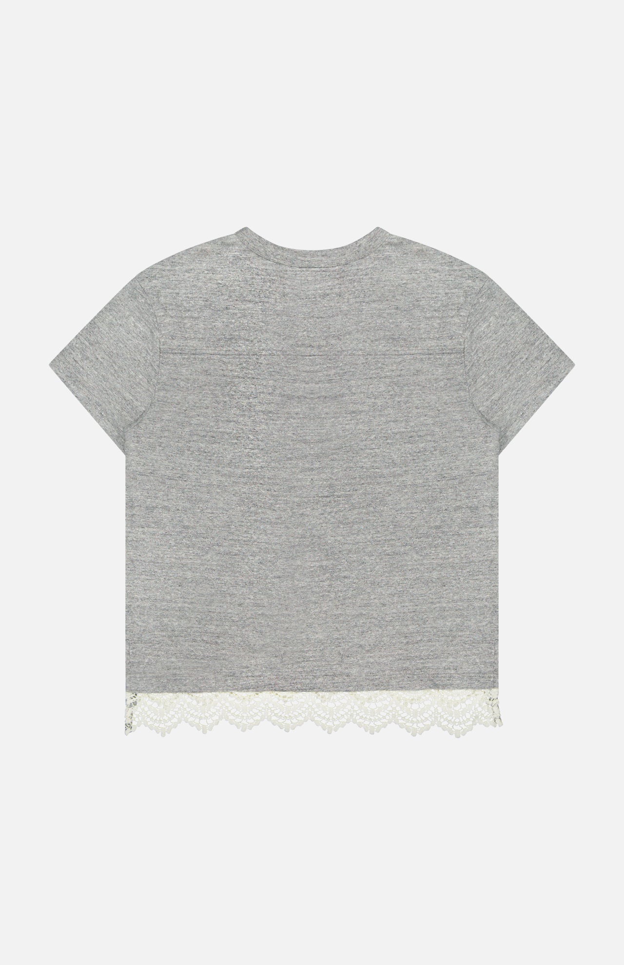 The Footballer Lace T-shirt by MOTHER is an oversized gray cotton tee with short sleeves and a round neckline, shown from the back. It features a scalloped white lace trim along the bottom hem for a unique twist on sporty style.