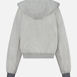 Back view of The Half Base Hoodie Sweatshirt by MOTHER, a light grey, fleece-lined cotton hoodie with long sleeves and dark gray ribbed cuffs, displayed against a plain white background.