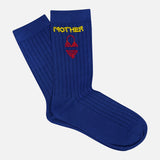 The Half Step Beaded Socks by MOTHER are blue ribbed statement socks featuring “MOTHER” in yellow and a red handbag design—perfect for adding fun to your summer sock collection.