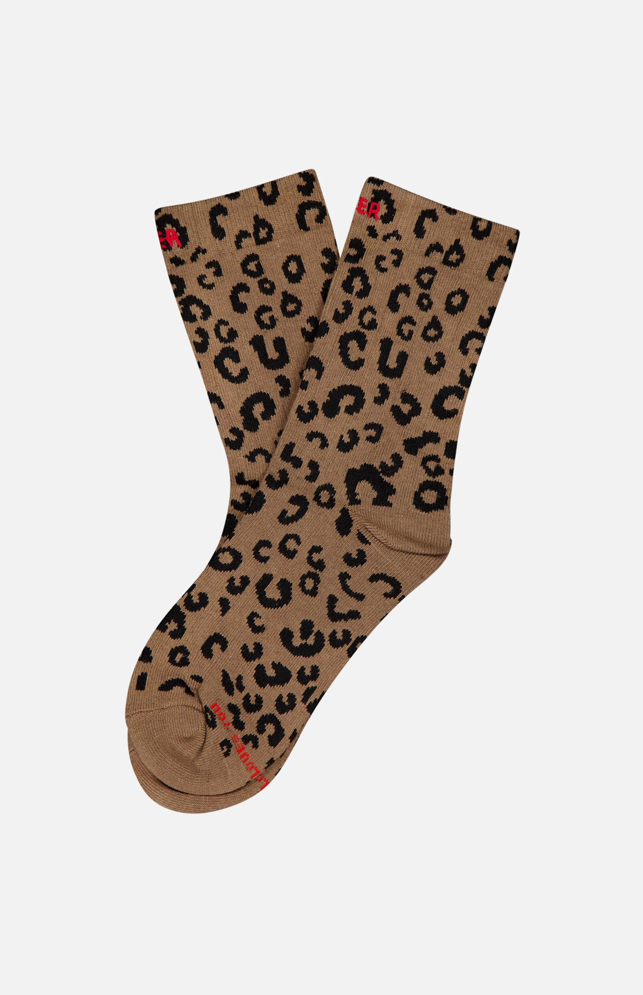 The Half-Step Cheetah Socks by MOTHER, featuring a black cheetah print on brown, are laid flat on a white background.