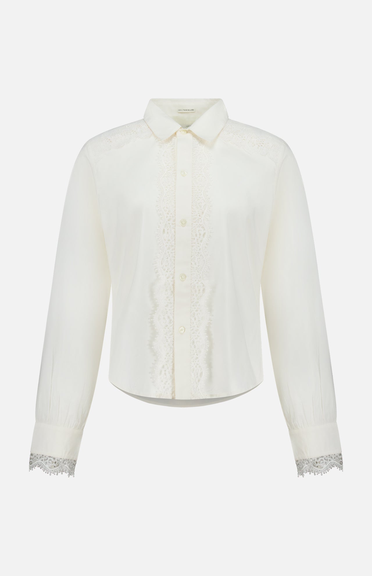 The Headup Honey Shirt by MOTHER is a white long-sleeve blouse with lace trim along the button placket and cuffs, featuring a classic collar and button-down front that combines timeless elegance with subtle western-inspired detailing, displayed on a plain white background.