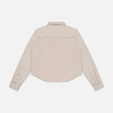 The Honor Roll Cropped Shirt by MOTHER is a beige women's button-up, shown from the back with a classic collar, cropped hem, and buttoned cuffs, displayed on a plain white background.