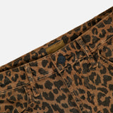 Close-up of The Hustler Flood Pant in Leap Year by MOTHER, featuring high-rise flare silhouette in stretch corduroy with leopard print, showcasing the waistband, front button, belt loops, and part of the front pockets against a white background.