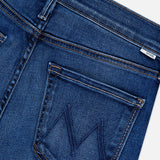 Close-up of the back pocket on MOTHER's The Insider Skimp Jean in Taking Chances, a blue stretch denim style with high waist, bootcut leg, stitched M detail, and vintage-inspired fabric label on the waistband.