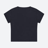 The Itty Bitty Ringer T-shirt by MOTHER is displayed laid flat with the back side facing up against a light grey background.