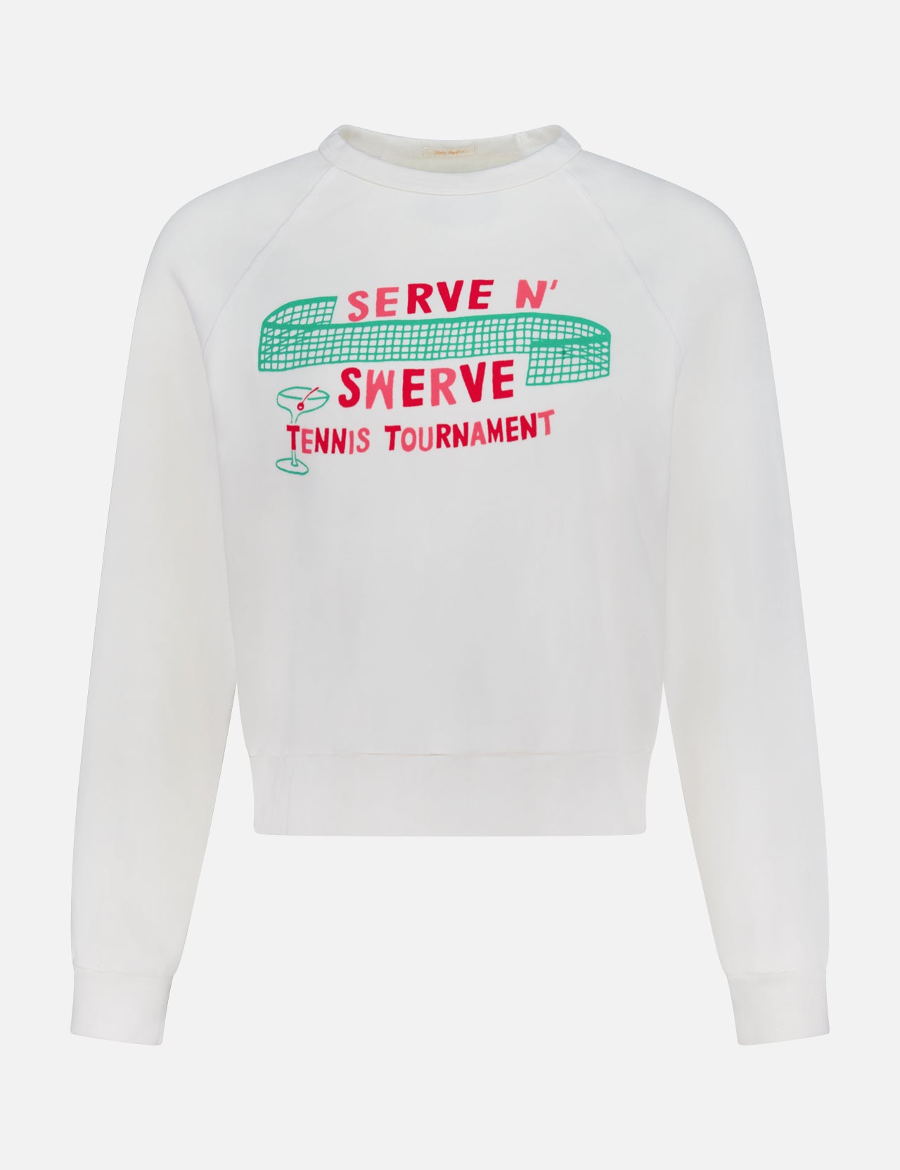 The Itty Concert Tennis Sweater by MOTHER is a white 100% cotton cropped raglan sweatshirt with "SERVE N SWERVE TENNIS TOURNAMENT" in red and green, plus bold net, ball, and racket graphics above the text.