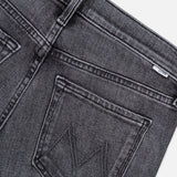 Close-up of the back of The Jinx Sneak Jeans in Cliffhanger by MOTHER, crafted from dark grey stretch denim, featuring two back pockets with stitching detail and a small white tag near the waistband, shot against a white background.