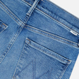 Close-up of the back pocket on MOTHER’s The Kick It Straight Leg Jean in Bitchin’ mid-blue wash, featuring a stitched M detail and part of the waistband with a belt loop.