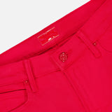 Close-up of the waistband and upper section of The Kick It Pant in Tango Red by MOTHER, featuring a button closure, belt loops, pockets, and a rectangular label on the inner waistband.