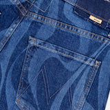 Close-up of The Lasso Sneak Abstract Print Jean by MOTHER, featuring abstract stripes, a stitched back pocket with a subtle M detail, belt loops, and a dark waistband adorned with a small rectangular brand label.