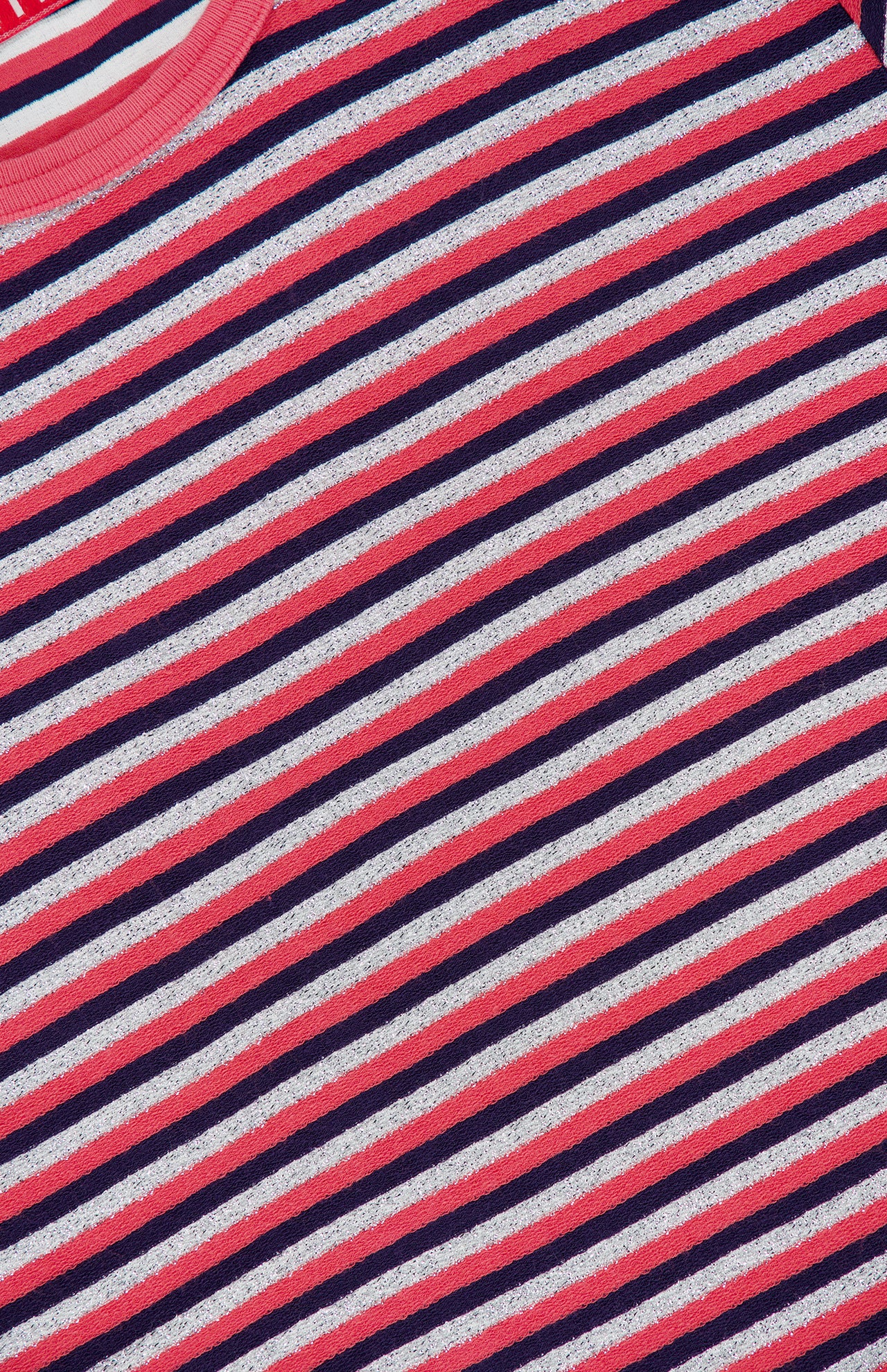Close-up of The Lil Goodie Ringer T-shirt, a glittery, cropped ringer tee featuring diagonal stripes in red, white, and navy blue with a pink ribbed crew neckline.